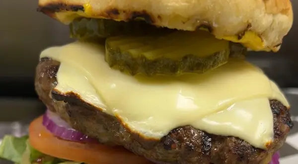 Signature cheeseburger served at TimeOut Sports Bar & Restaurant