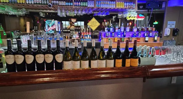 TimeOut bar wine bottle selection with full bar in background