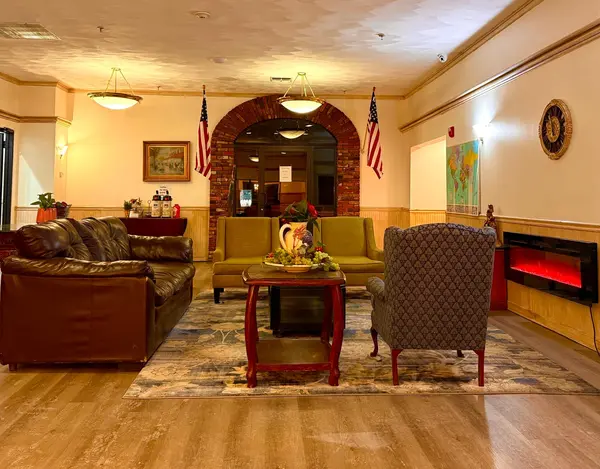 Welcoming lobby seating area with fireplace at Presque Isle Hotel