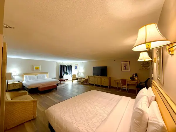Double King Suite — wide-angle view of both beds at Presque Isle Hotel