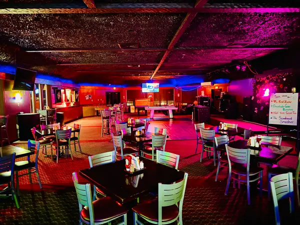 TimeOut Sports Bar main bar area with neon lighting and pool table