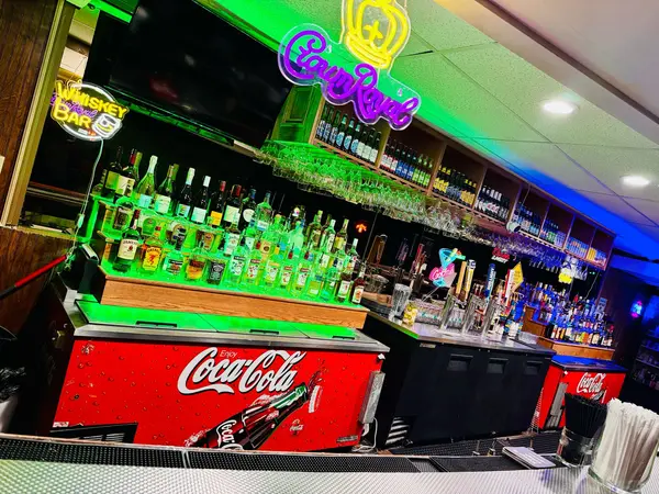 TimeOut full bar with Crown Royal neon sign and full spirits selection