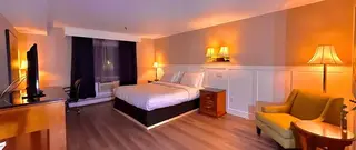Renovated guest room with warm ambient lighting